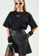 DIESEL T-shirt TLIXIN cropped nera per donna, ragazzi e bambini con logo Diesel frontale effetto sfrangiato. J0291800YI9 K900 DIESEL 