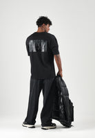 EA7 T-shirt manica corta nera da uomo con maxi logo gommato tono su tono sul retro. 7M002107AF10441 UC001 EA7 