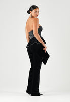 ELISABETTA FRANCHI Tuta nera per donna con elegante corpetto bustier a fascia, dettaglio peplo in vita e pantaloni a zampa. TU06967E2 110 ELISABETTA FRANCHI 