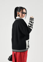 GCDS Cardigan nero per donna, ragazzi e bambini con elegante motivo bicolore a contrasto e maxi logo frontale C2BJQF590K347 999A GCDS 