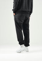 GCDS Pantaloni casual neri  per uomo e donna con coulisse in vita e inserti monogramma jacquard a contrasto. C2MWQI122F245 999I GCDS 