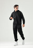GCDS Pantaloni casual neri  per uomo e donna con coulisse in vita e inserti monogramma jacquard a contrasto. C2MWQI122F245 999I GCDS 