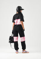 GCDS T-shirt manica corta black-pink-nera e rosa per donna, ragazzi e bambini con banda centrale rosa Z0GJQC585J105 999P GCDS 