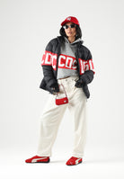 GCDS Piumino DOWN JACKET WITH BAND LOGO nero e rosso per uomo e per donna Z0MLQA110T258 999R GCDS 