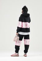 GCDS Felpa con cappuccio HOODIE COLORBLOCK  nera-rosa per uomo e donna coon maxi fascia logata a contrasto. Z0MLQE138F004 999P GCDS 