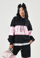 GCDS Felpa con cappuccio HOODIE COLORBLOCK  nera-rosa per uomo e donna coon maxi fascia logata a contrasto. Z0MLQE138F004 999P GCDS 
