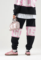 GCDS Pantaloni neri-rosa per uomo e donna con coulisse in vita e logo stampato. Z0MLQI209F004 999P GCDS 