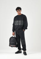 GCDS Pantaloni neri da uomo con maxi logo frontale Z0MLQI211F004 999B GCDS 