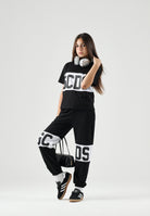 GCDS T-shirt a manica corta nera e bianca per donna, ragazzi e bambini con stampa logo Z0UJQC585J105 999A GCDS 