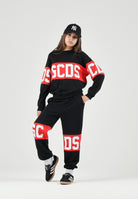 GCDS Felpa girocollo nera e rossa per donna, ragazzi e bambini con iconica fascia logo a contrasto.<BR/> Z0UJQE584F004 999R GCDS 