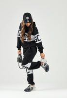 GCDS Pantaloni BAND LOGO TRACK PANTS nero per donna, ragzzi e bambini con fascia e maxi logo GCDS a contrasto. Z0UJQI588F004 999A GCDS 