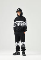 GCDS Pantaloni BAND LOGO TRACK PANTS nero per donna, ragzzi e bambini con fascia e maxi logo GCDS a contrasto. Z0UJQI588F004 999A GCDS 