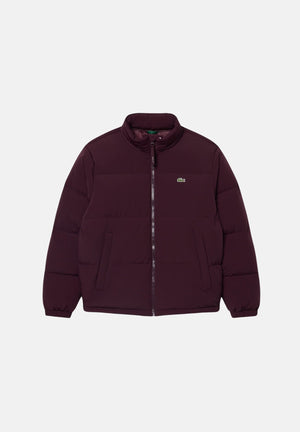 LACOSTE Piumino  bordeaux scuro da uomo, regular fit, imbottito in piuma, con zip frontale e tasche con zip. BH5154 3KE LACOSTE 