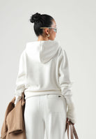 LACOSTE Felpa con cappuccio Piqué Hoodie, bianca, per uomo e donna con coccodrillo ricamato sul petto.<BR/> SF5259 70V LACOSTE 