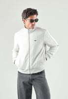 LACOSTE Felpa con zip ghiaccio-bianco da uomo con motivo monogramma jacquard. SH1368 4IW LACOSTE 