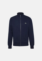 LACOSTE Felpa DOUBLE FACE PIQUÉ ZIPPED Blu Navy  da uomo, in piqué double-face con collo alto, zip integrale e logo ricamato.<BR/> SH9454 166 LACOSTE 