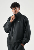 LACOSTE Tuta SOLID TRACKSUIT nera per uomo in tessuto tecnico con mini logo iconico WH6790 ZDQ LACOSTE 