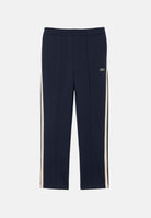 LACOSTE Pantaloni PIPED TRACK PANTS blu per uomo con bande laterali e coulisse in vita. XH8615 MXQ LACOSTE 