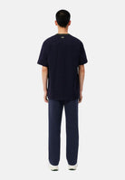 LACOSTE Pantaloni PIPED TRACK PANTS blu per uomo con bande laterali e coulisse in vita. XH8615 MXQ LACOSTE 