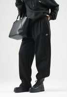 LACOSTE Pantaloni sportivi neri da uomo e donna con coccodrillo ricamato. XH8867 031 LACOSTE 