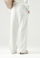 LACOSTE Pantaloni bianchi sportivi per uomo e donna con coccodrillo ricamato XH8867 70V LACOSTE 