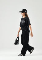 MM6 MAISON MARGIELA T-shirt manica corta nera per donna, ragazzi e bambini con logo numerico MM6 stampato sul davanti. M61117MM02Y M6900 MAISON MARGIELA 