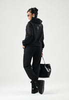 MARCELO BURLON COUNTY OF MILAN Felpa con cappuccio WINGS nera per donna e ragazza con  grafica effetto gioiello sul davanti. F6CMJGHS073 110 MARCELO BURLON COUNTY OF MILAN 