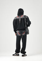 MARCELO BURLON COUNTY OF MILAN Pantaloni JOGGER CON LOGO neri da uomo con mini logo laterale F6CMMAFP014 110 MARCELO BURLON COUNTY OF MILAN 