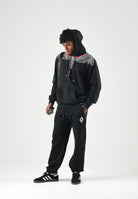 MARCELO BURLON COUNTY OF MILAN Pantaloni JOGGER CON LOGO neri da uomo con mini logo laterale F6CMMAFP014 110 MARCELO BURLON COUNTY OF MILAN 