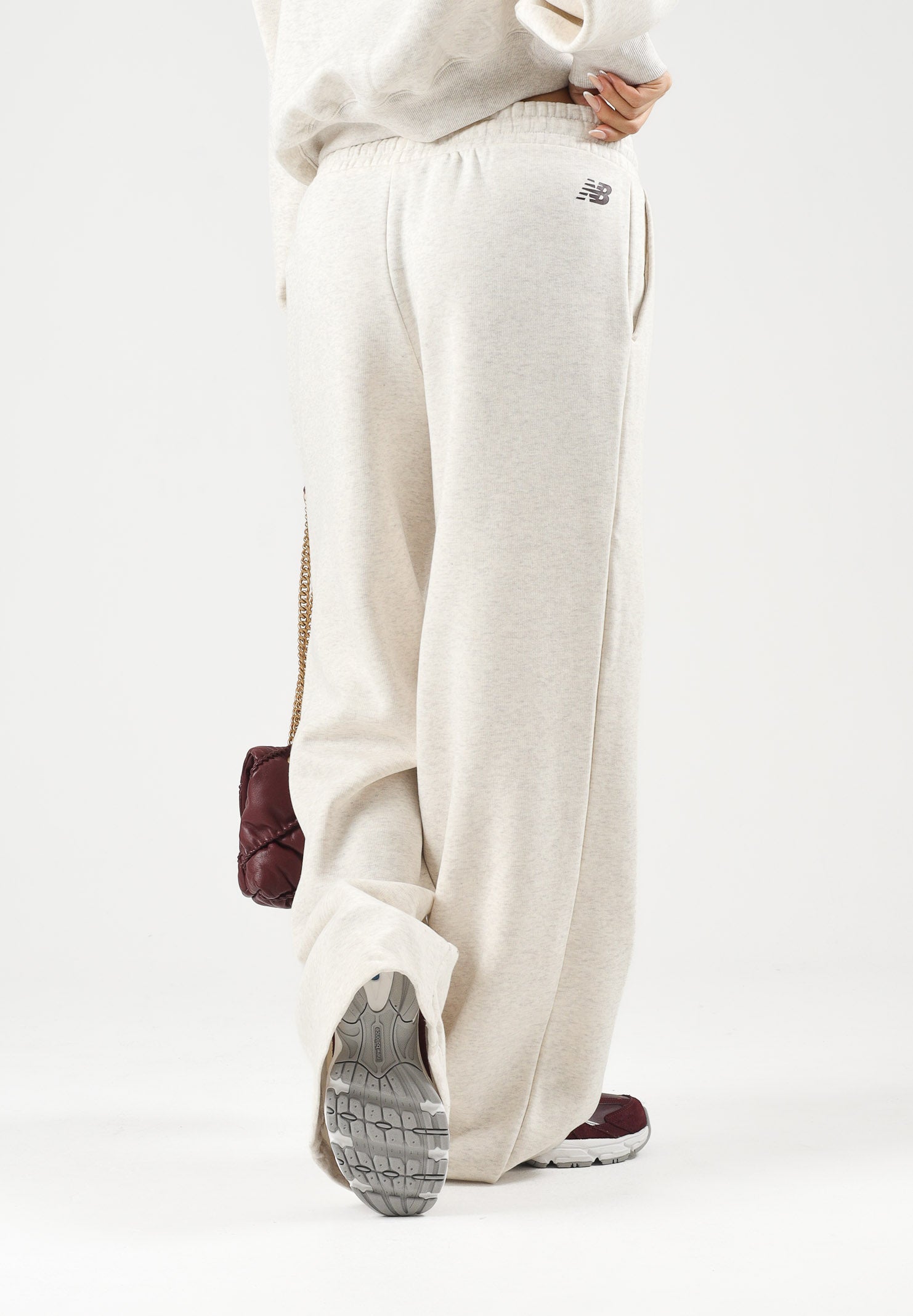 NEW BALANCE Pantaloni TRACKSIDE FLEECE bianco-panna da donna WB62983ALIT . NEW BALANCE 