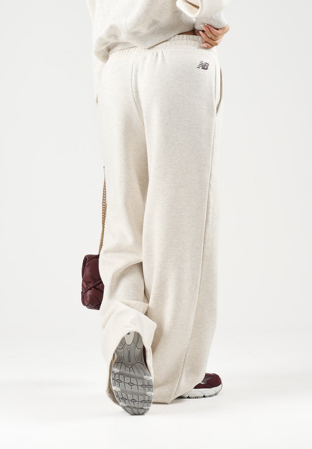 NEW BALANCE Pantaloni TRACKSIDE FLEECE bianco-panna da donna WB62983ALIT . NEW BALANCE 