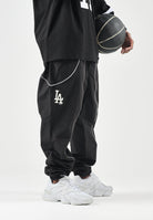 NEW ERA Pantaloni sportivi nero scuro per uomo e donna con mini logo laterale. 60897501 . NEW ERA 