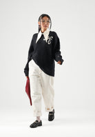 NEW ERA Maglione girocollo nero per uomo e donna con logo iconico laterale 60897502 . NEW ERA 