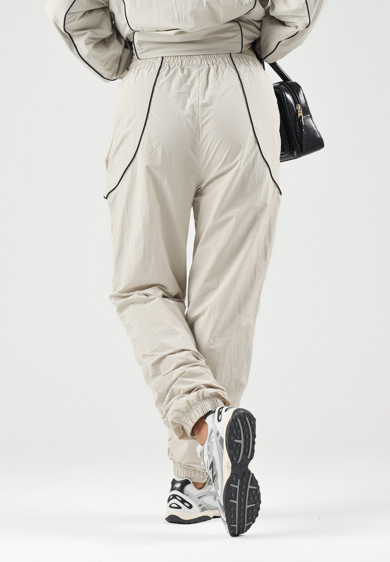 NEW ERA Pantaloni sportivi sabbia/ beige chiaro per uomo e donna 60897518 . NEW ERA 