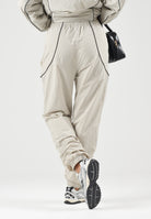 NEW ERA Pantaloni sportivi sabbia/ beige chiaro per uomo e donna 60897518 . NEW ERA 