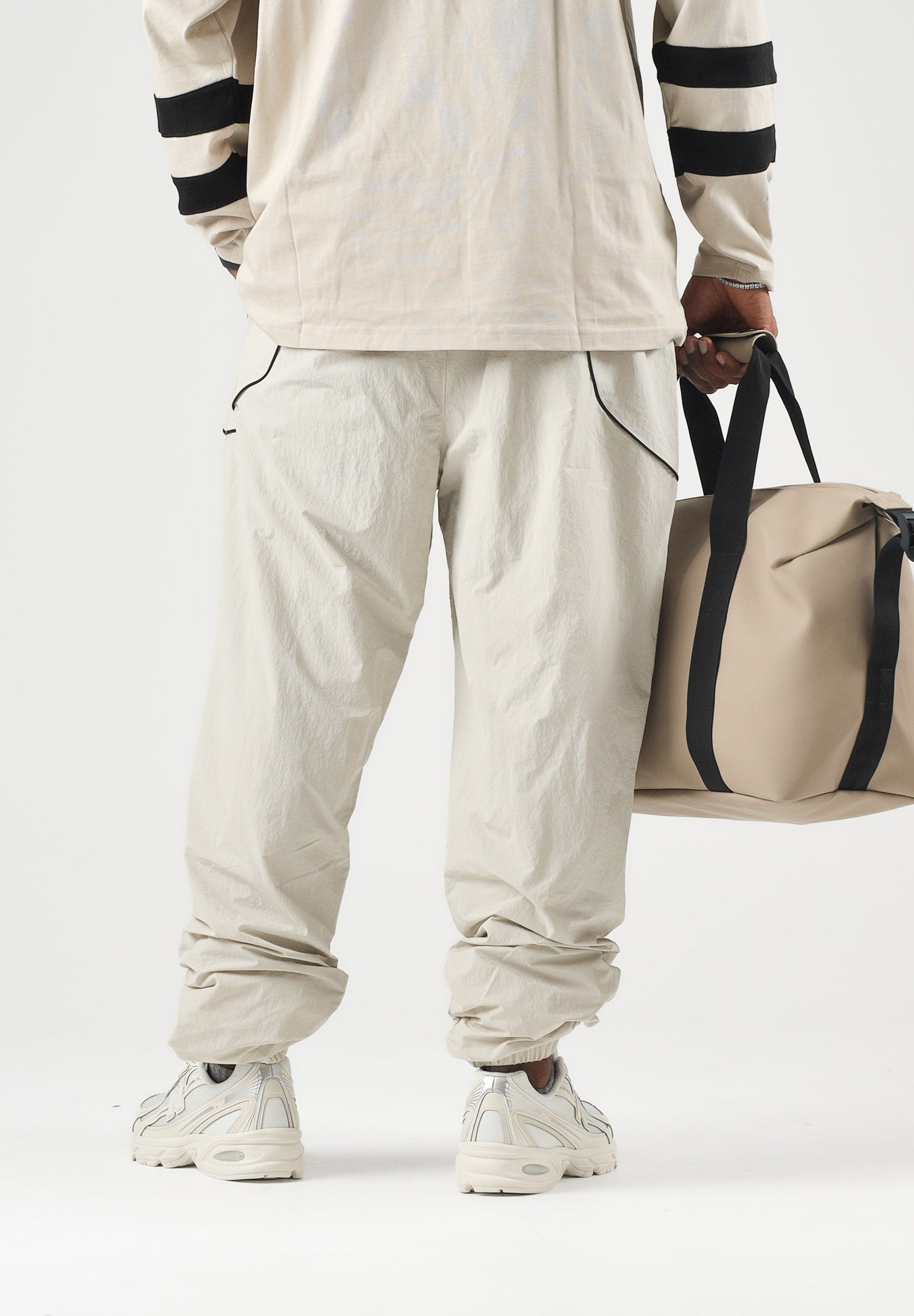 NEW ERA Pantaloni sportivi sabbia/ beige chiaro per uomo e donna 60897518 . NEW ERA 