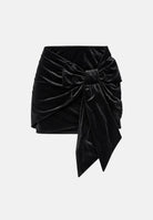 ONLY Minigonna BOW FRONT VELVET MINI SKIRT Black nera da donna, in morbido velluto elasticizzato, con drappeggio frontale, maxi fiocco laterale e lunghe estremità pendenti. 15383725 BL ONLY 