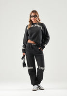 PALM ANGELS Pantalone nero per donna, ragazza e donna con vita elasticizzata regolabile con coulisse a contrasto F6PAJBFP016 110 PALM ANGELS 