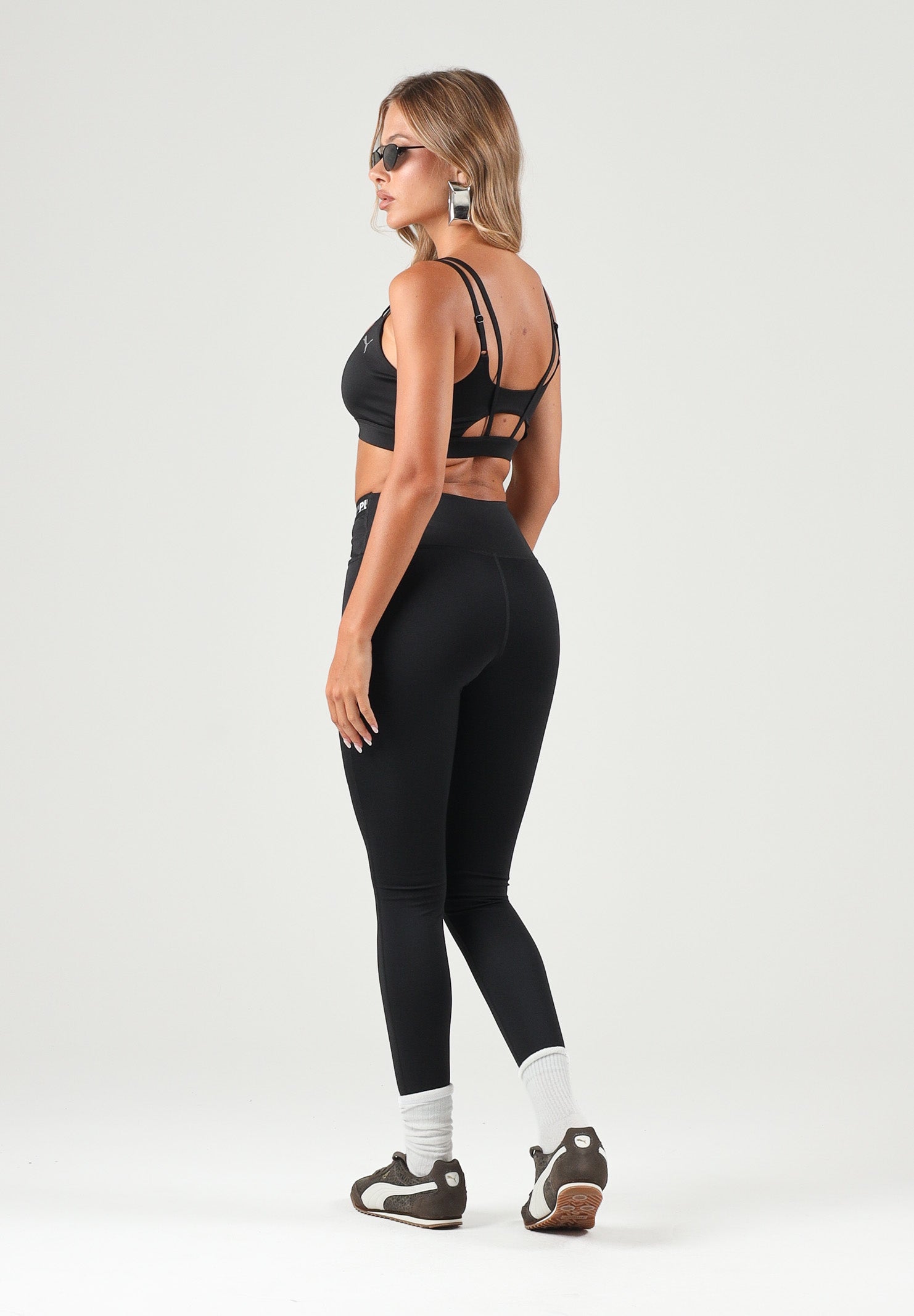 PUMA Leggings sportivo nero per donna con cintura elastica logata incrociata. 528498 01 PUMA 