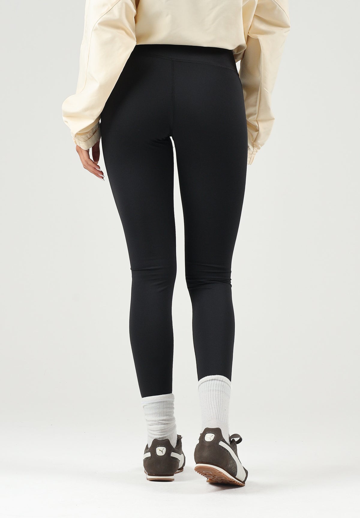 PUMA Leggings sportivo nero per donna con cintura elastica logata incrociata. 528498 01 PUMA 
