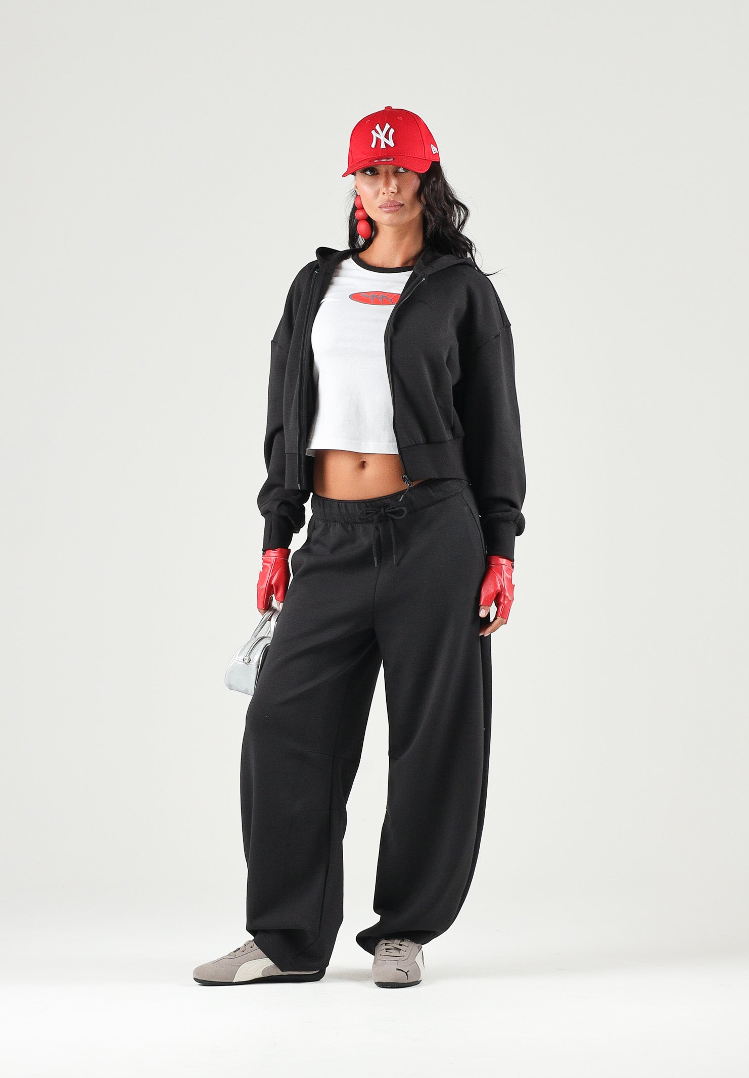 PUMA Felpa con zip PUMATECH  nera per donna con cappuccio e taglio cropped. 634571 01 PUMA 