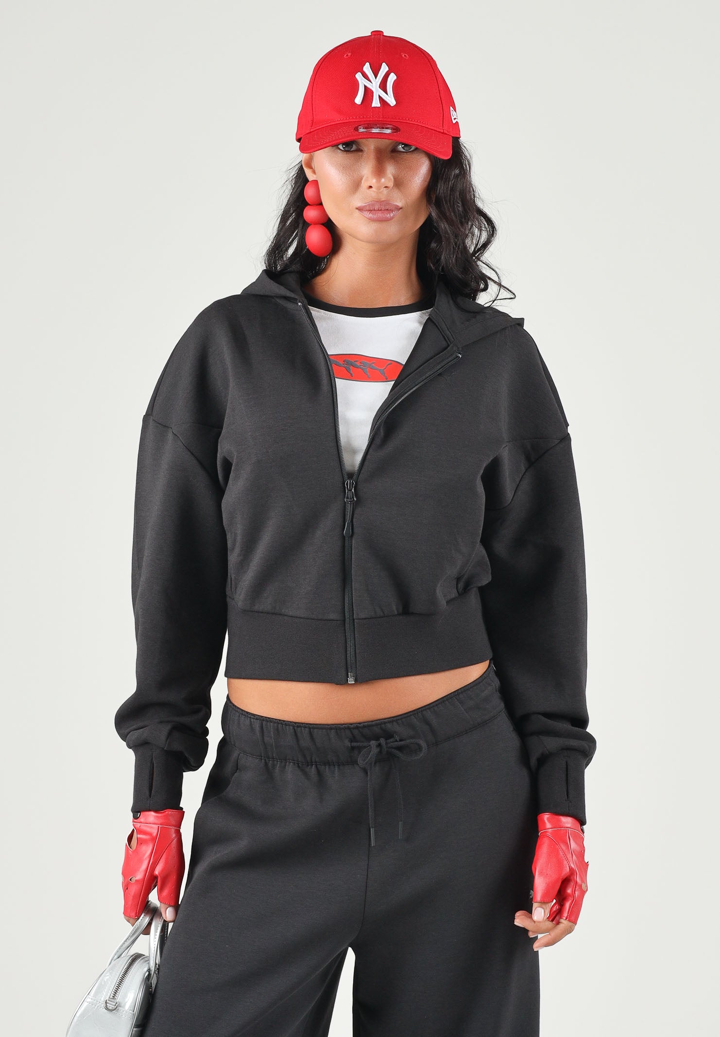 PUMA Felpa con zip PUMATECH  nera per donna con cappuccio e taglio cropped. 634571 01 PUMA 