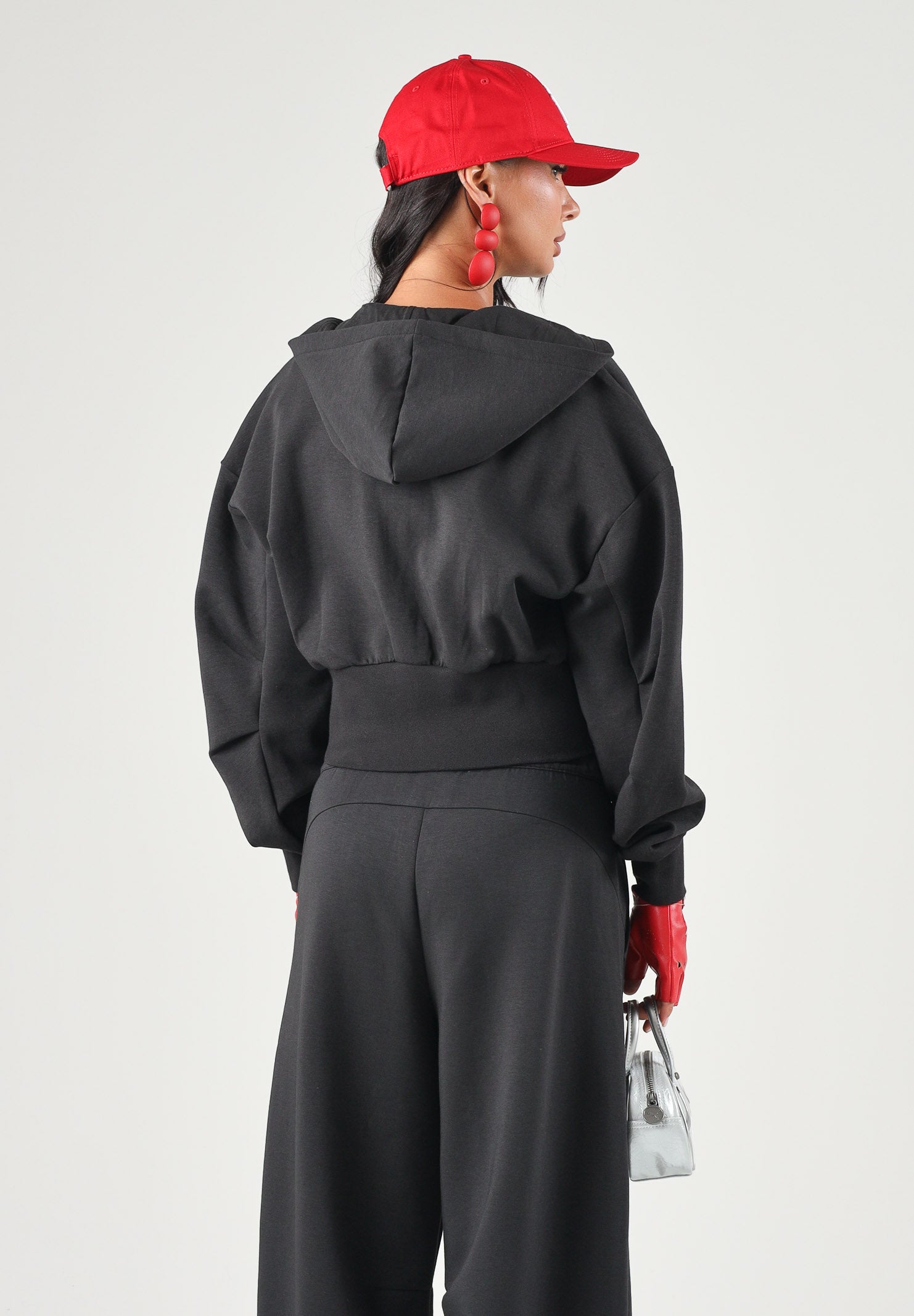 PUMA Felpa con zip PUMATECH  nera per donna con cappuccio e taglio cropped. 634571 01 PUMA 