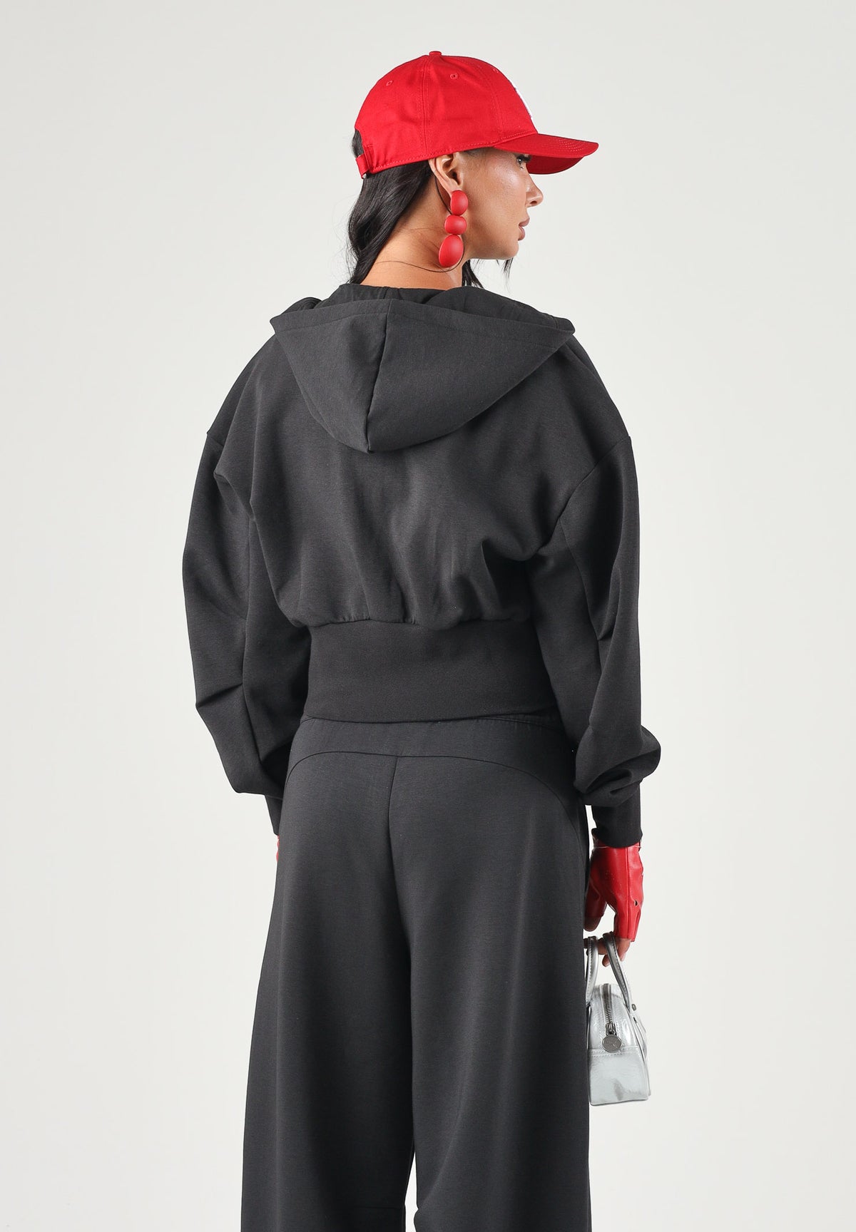 PUMA Felpa con zip PUMATECH  nera per donna con cappuccio e taglio cropped. 634571 01 PUMA 