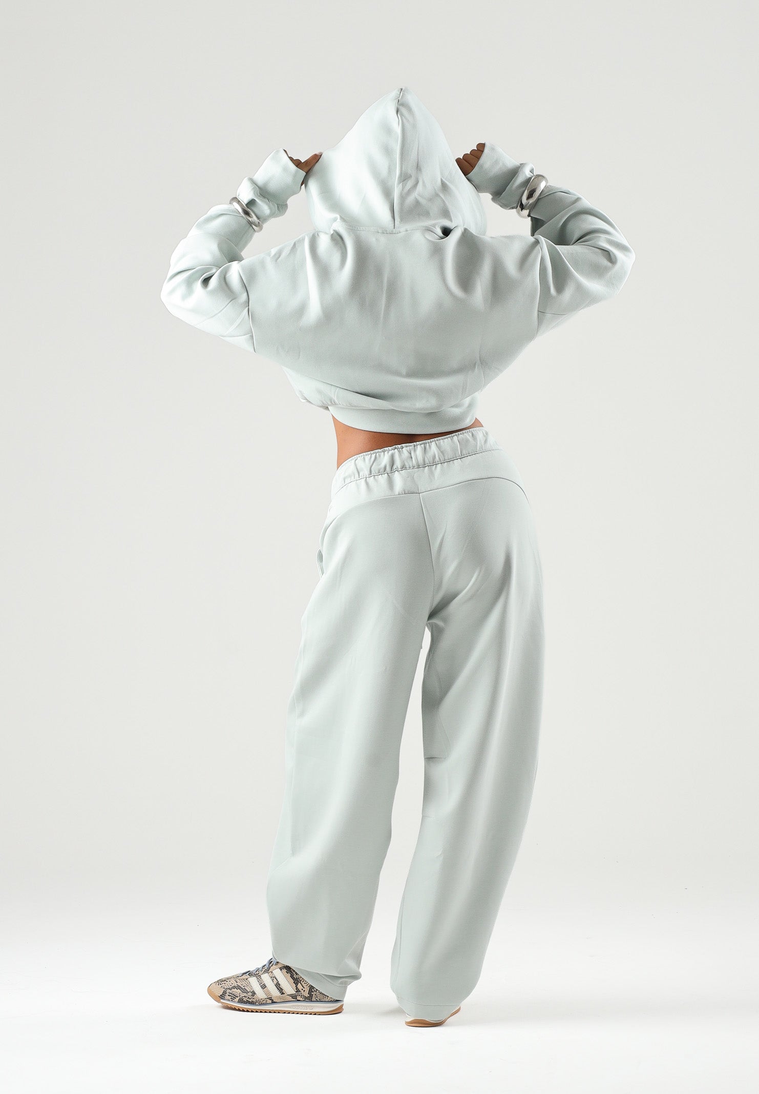PUMA Felpa PUMATECH  verde acqua per donna con cappuccio, zip parziale e taglio cropped. 634571 29 PUMA 