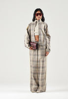 PUMA Giacca a vento Tartan beige per donna con motivo a quadri, collo alto e strisce laterali a contrasto. 636628 81 PUMA 
