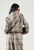 PUMA Giacca a vento Tartan beige per donna con motivo a quadri, collo alto e strisce laterali a contrasto. 636628 81 PUMA 