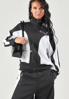 PUMA Felpa con zip DARE TO WOVEN T nero per donna con design bicolore, collo alto e tasca frontale zippata. 636632 01 PUMA 