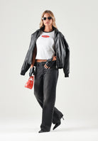 PUMA T-shirt manica corta DARE TO GRAPHIC  bianca da donna con bordi a contrasto e grafica logo sul petto. 636646 02 PUMA 