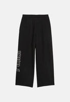 PUMA Pantaloni sportivi DARE TO nero per donna con vita alta elasticizzata, taglio gamba ampie e logo PUMA intessuto. 636652 01 PUMA 